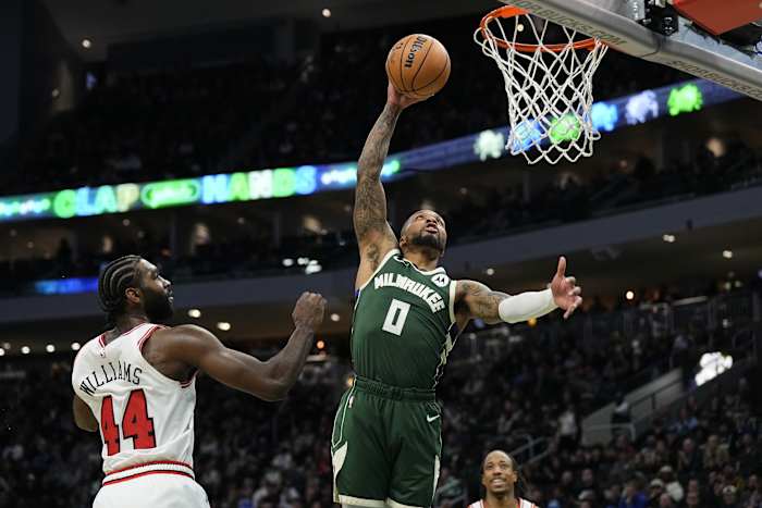 Milwaukee Bucks guard Damian Lillard (0) dunks in front of Chicago Bulls forward Patrick Williams (44)